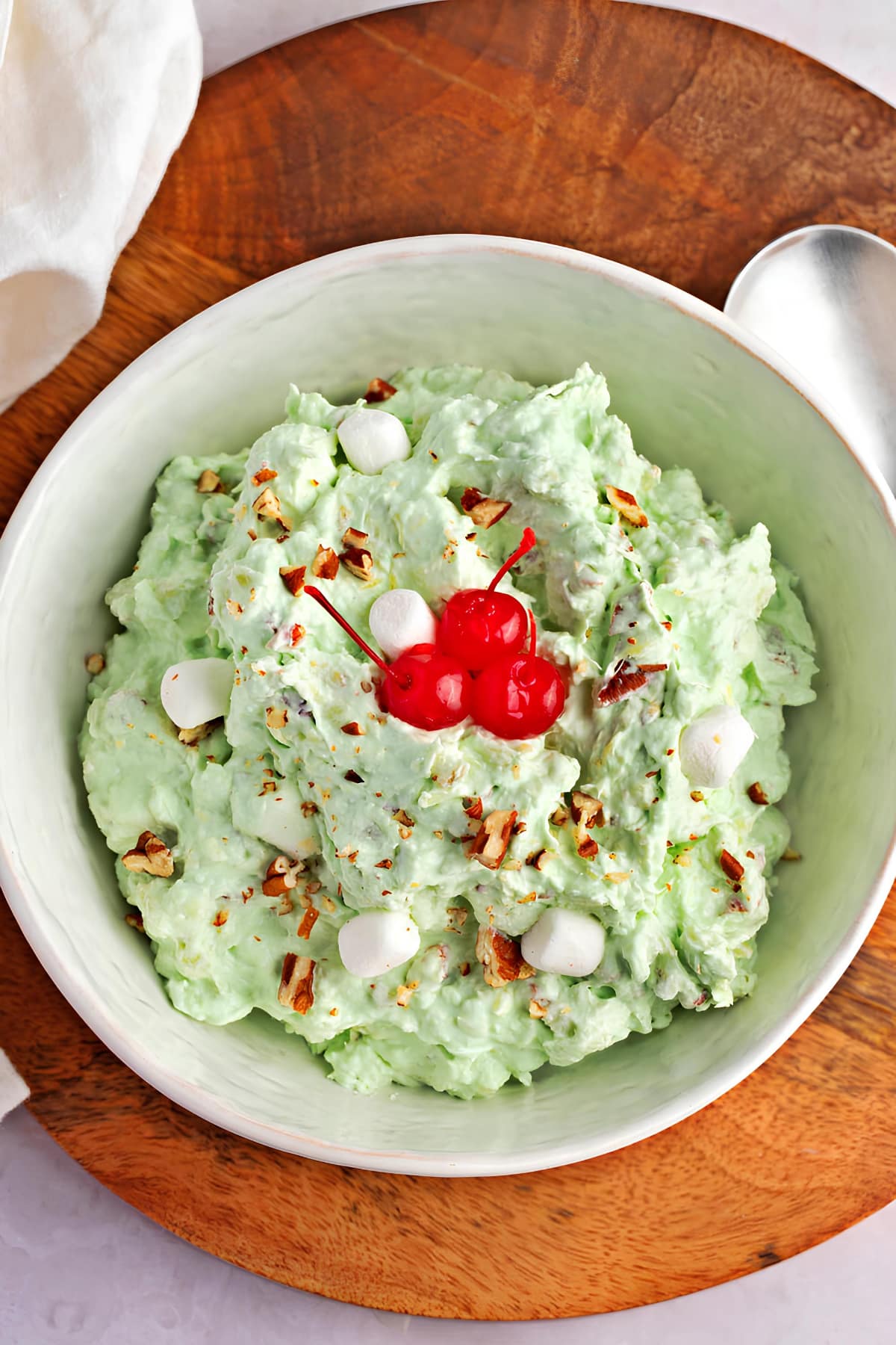 Homemade Watergate Salad Topped with Cherries and Mini Marshmallows