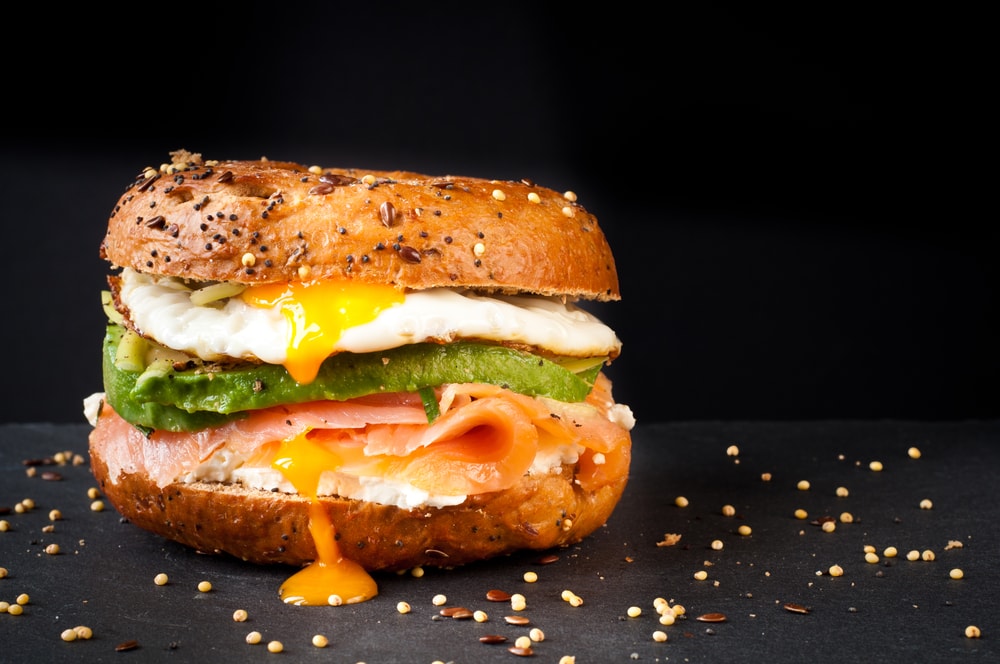 Bagel with avocado and fried egg