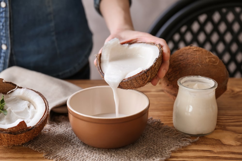 Woman Pouring Coconut Milk