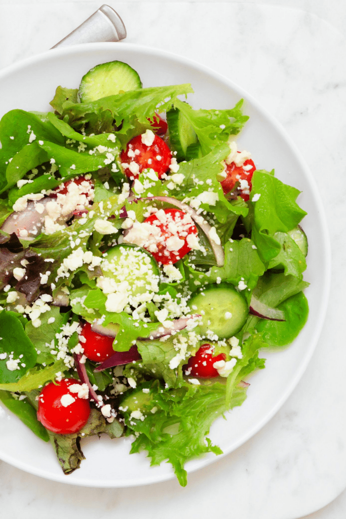 Green Salad with Lettuce, Onions, Tomatoes and Cucumber