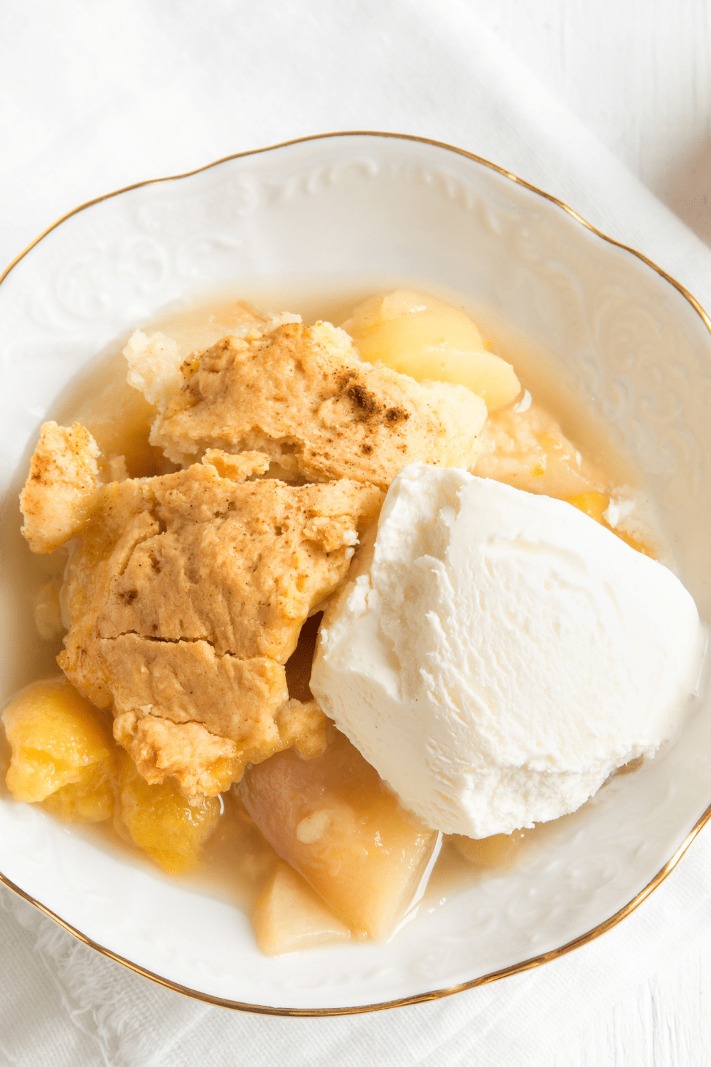 Peach Cobbler With Ice Cream On Plate