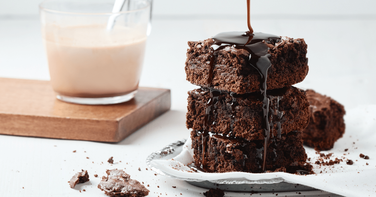 Chocolate Brownies with Chocolate Syrup Paired with Coffee