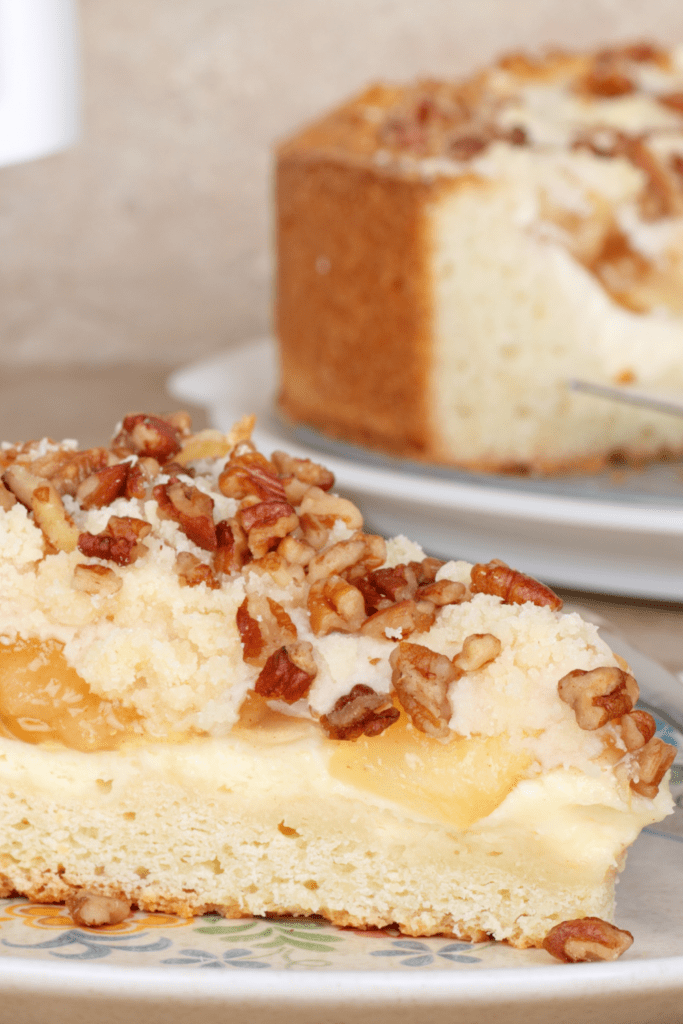 Slice of Cream Cheese Coffee Cake with Nuts on Top