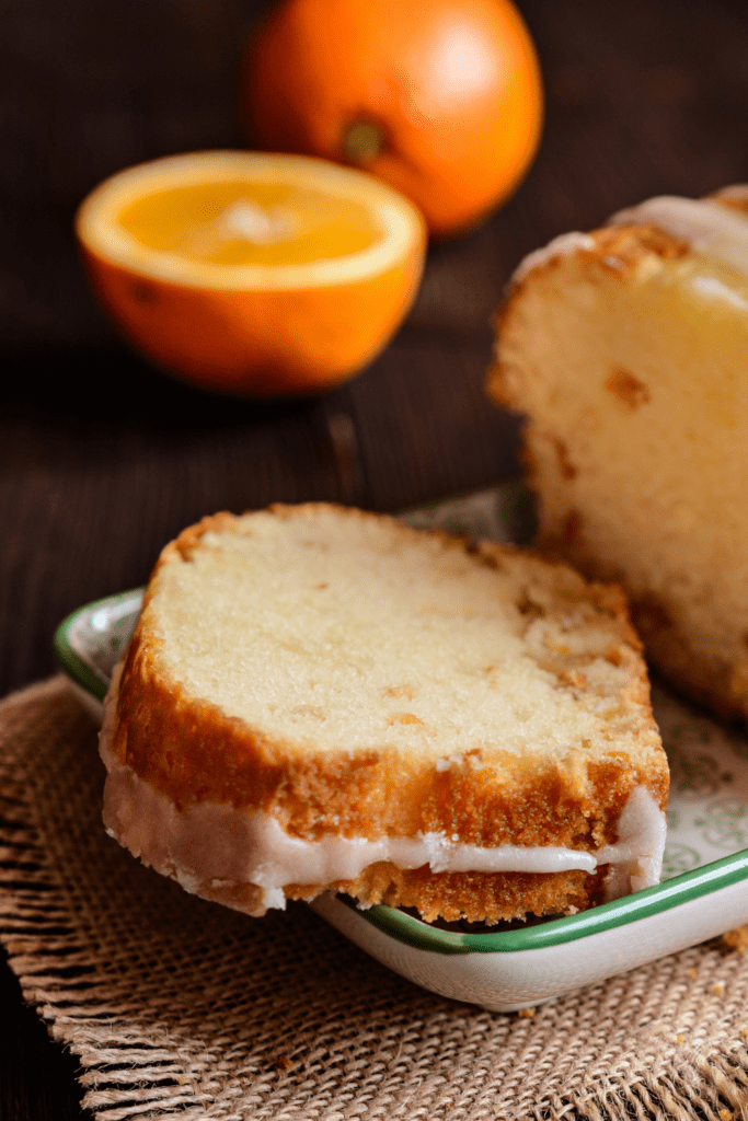 Slice of Orange Pound Cake with Fresh Oranges