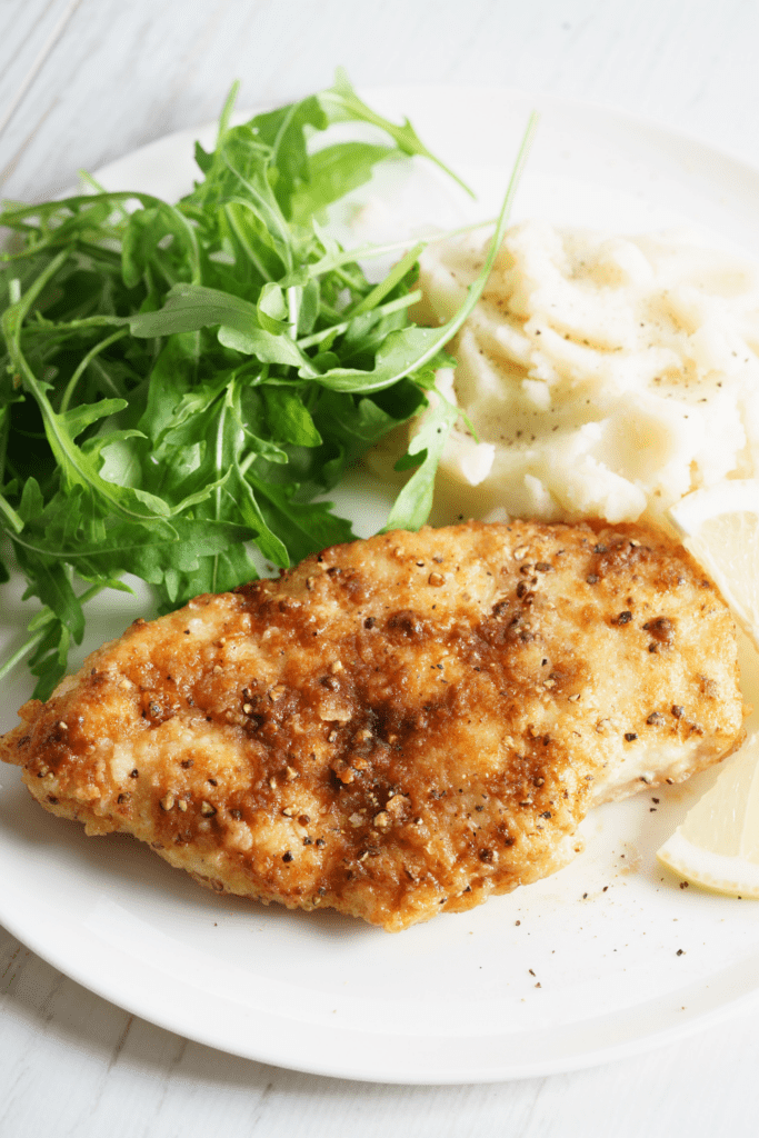 Melt in Your Mouth Chicken Served with Mashed Potato and Arugula