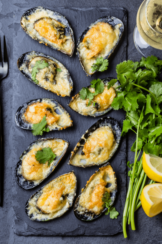 Baked Mussels with Cheese, Cilantro and Lemons