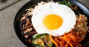 Bowl of Korean Bibimbap with Egg and Fried Rice