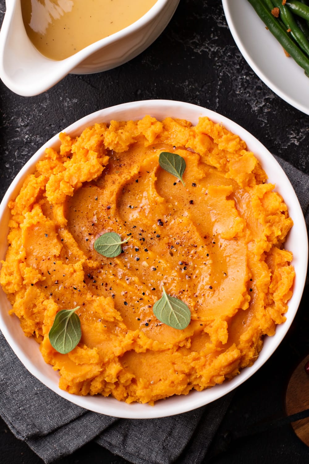 Top view of mashed sweet potatoes on a bowl.