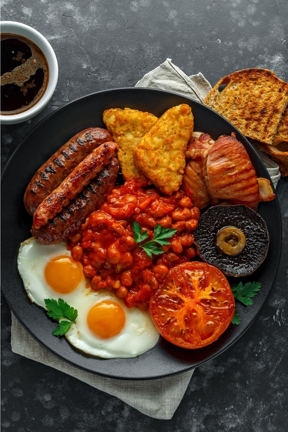 Full Irish Breakfast: Sausage, Hash Browns, Egg, Bacon, and Chickpeas