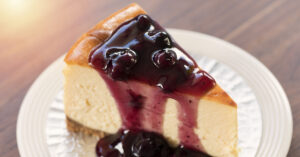 Homemade New York Cheesecake with Blueberry Sauce
