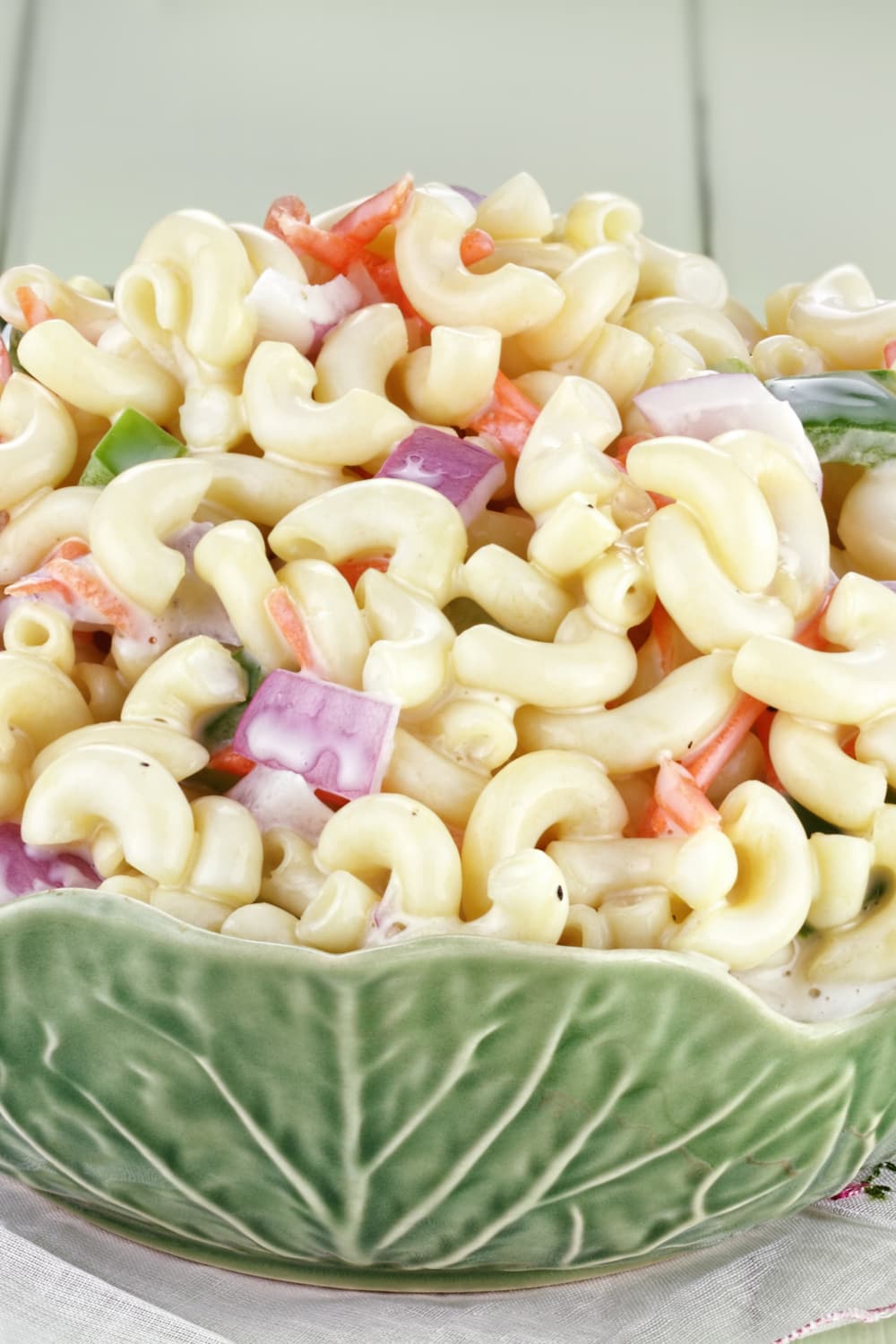 Macaroni salad with mayonnaise, onions, celery, red pepper, and dill pickle relish. 