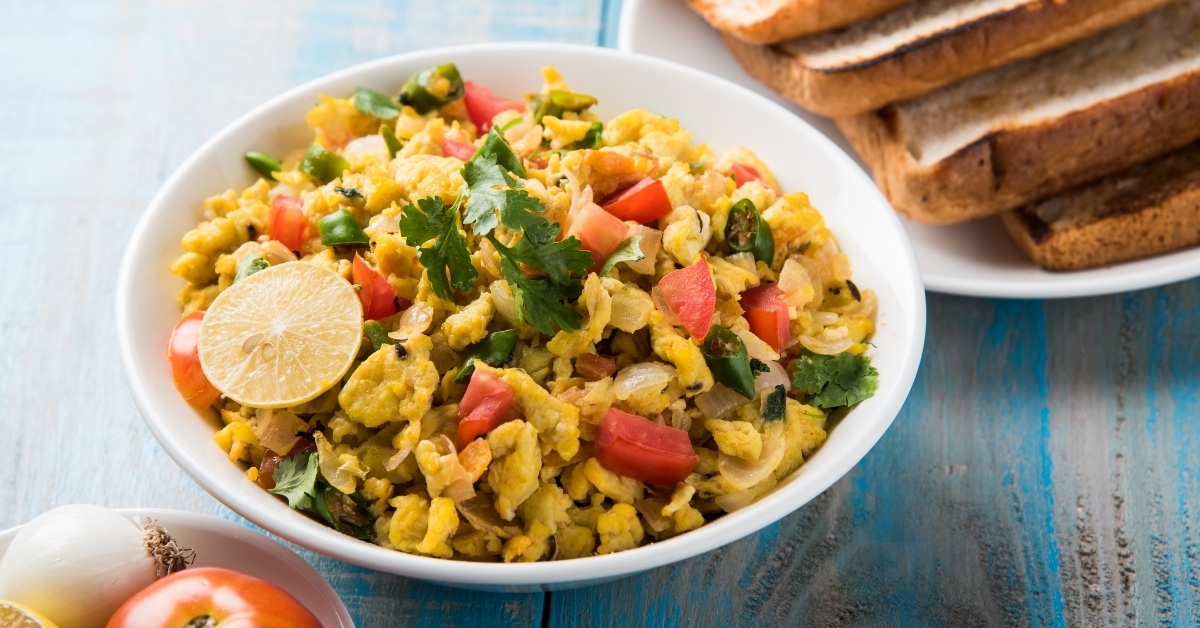 Spicy Scrambled Eggs in a Bowl with Toasted Bread