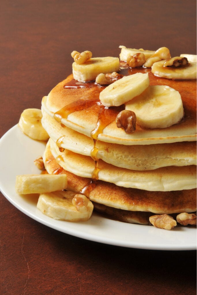 Coconut Flour Pancakes with Bananas and Syrup