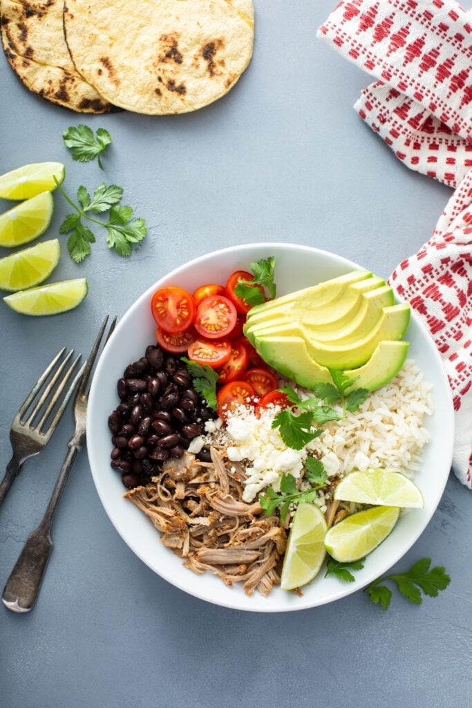 Mexican Burrito Bowl: Pork Carnitas, Black Beans, Tomatoes, Avocadoes, Lime and Rice