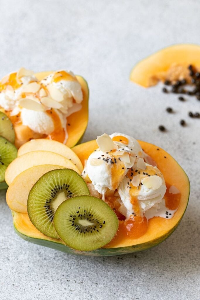 Papaya Boat Dessert with Ice Cream, Kiwi and Apples