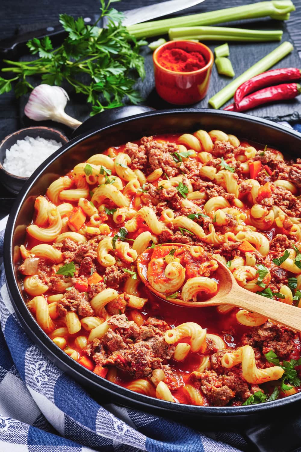 Goulash made with ground beef, tomatoes, celery and macaroni noodles on a pan. 
