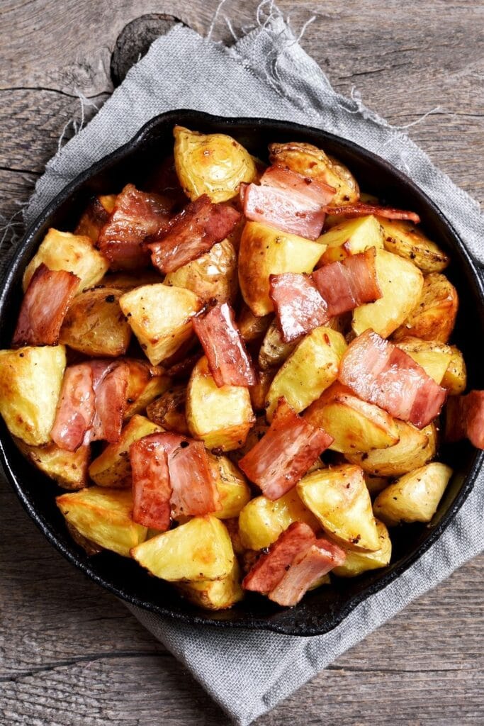 Fried Potatoes and Bacon in a Skillet
