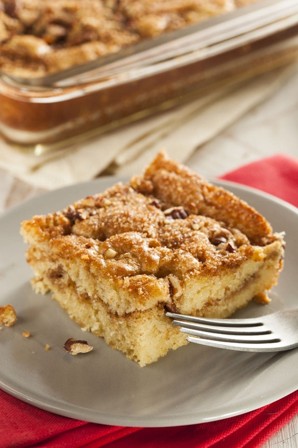 A slice of Snickerdoodle Coffee Cake in a Plate. 