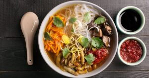 Warm Chinese Noodle Soup with Mushrooms and Vegetables