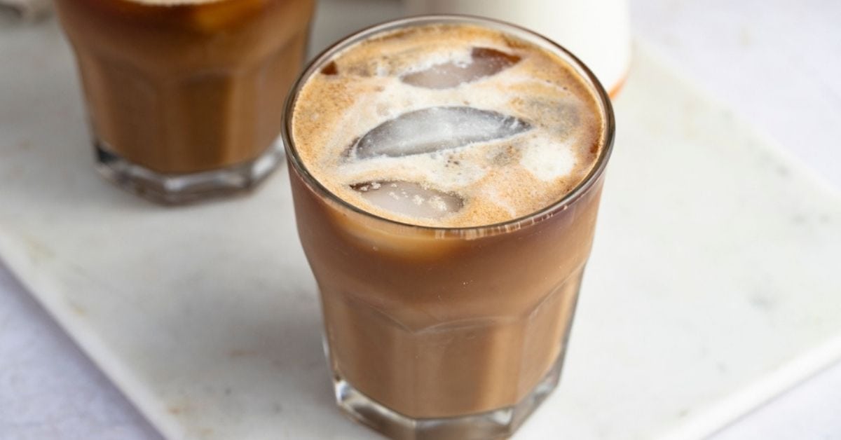 Homemade Cold Banana Milk Coffee in Glasses