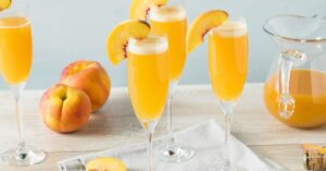 Peach Bellini Mimosas with Champagne in Wine Glasses