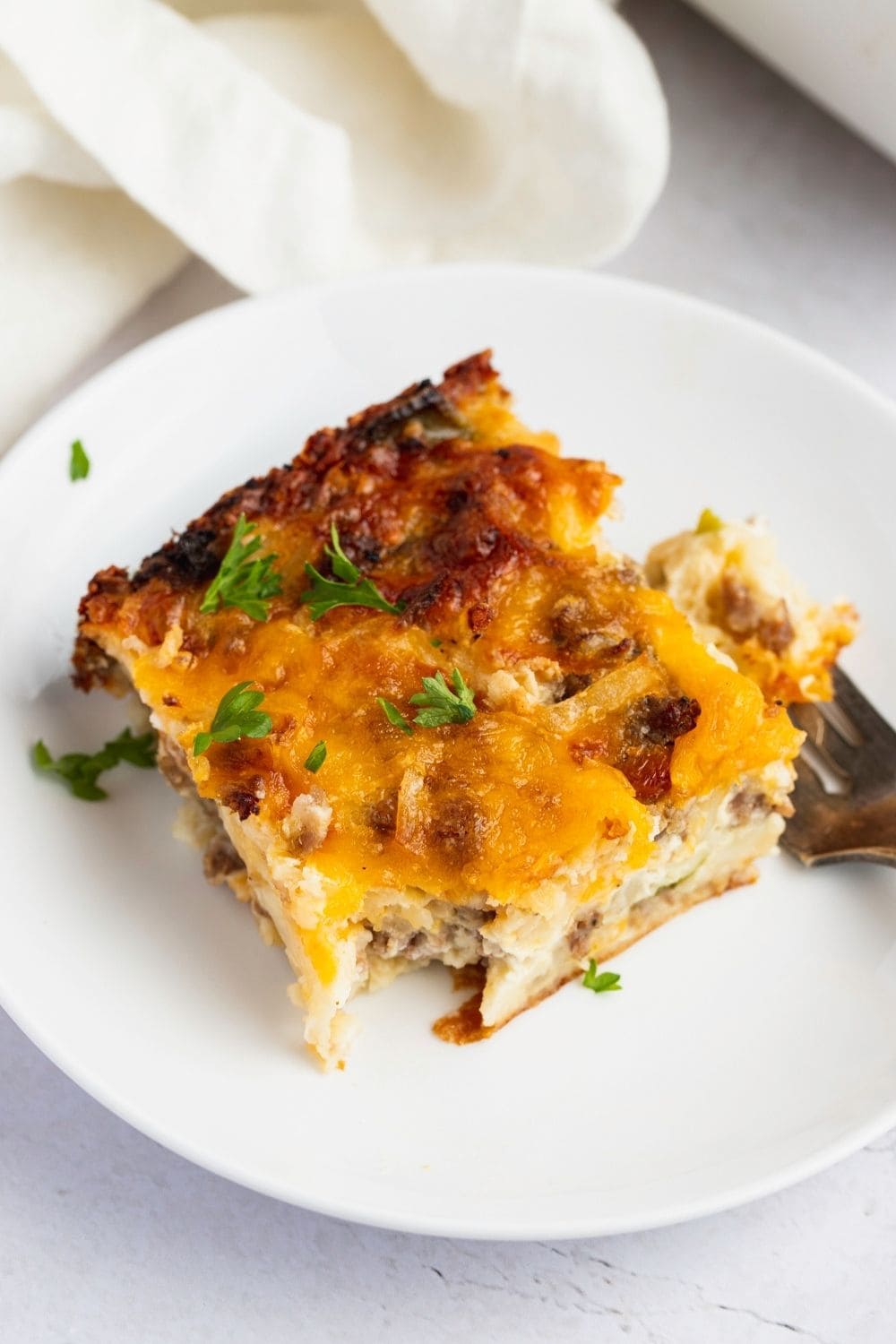 A Slice of Breakfast Casserole in a Plate