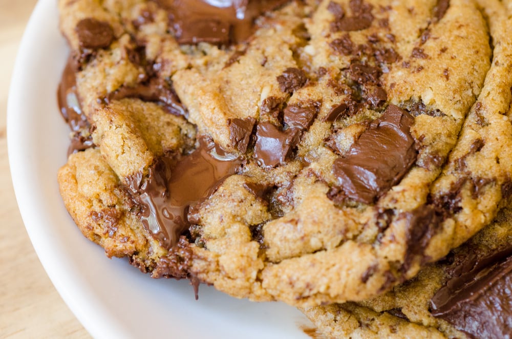 Ooey gooey chocolate chip cookie in a plate. 