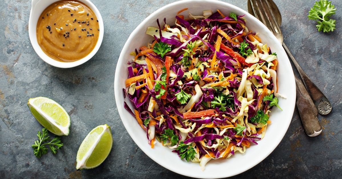 Bowl of Coleslaw with Lime and Peanut Butter Sauce