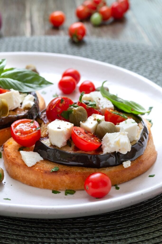 Bruschetta with Eggplant, Feta Cheese, Tomatoes, and Capers