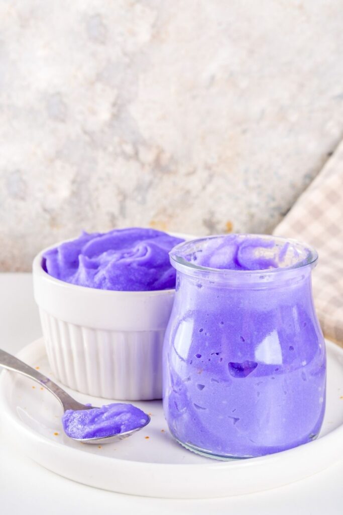 Beautiful ube recipes you need to try featuring homemade purple jam spread or ube halaya in a glass jar and ramekin on a plate.