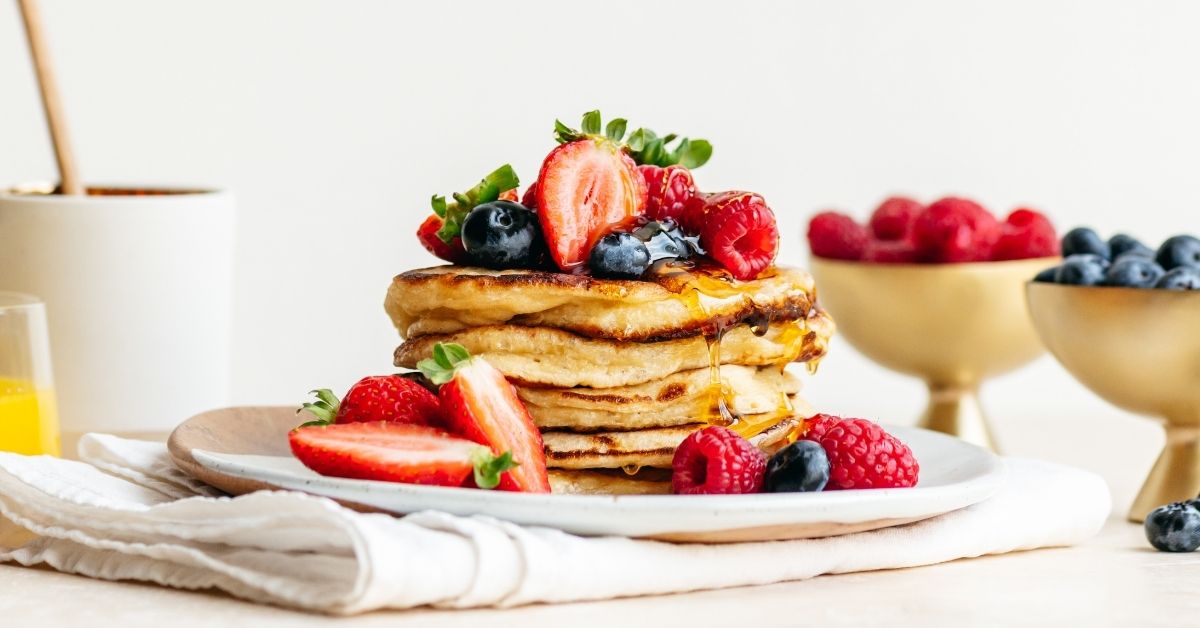 Homemade Sourdough Pancakes with Syrup and Berries