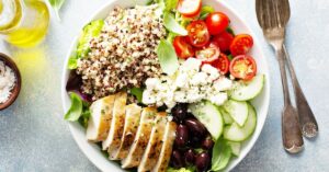 Homemade Greek Quinoa Bowl with Chicken, Cucumber, Olives and Tomatoes