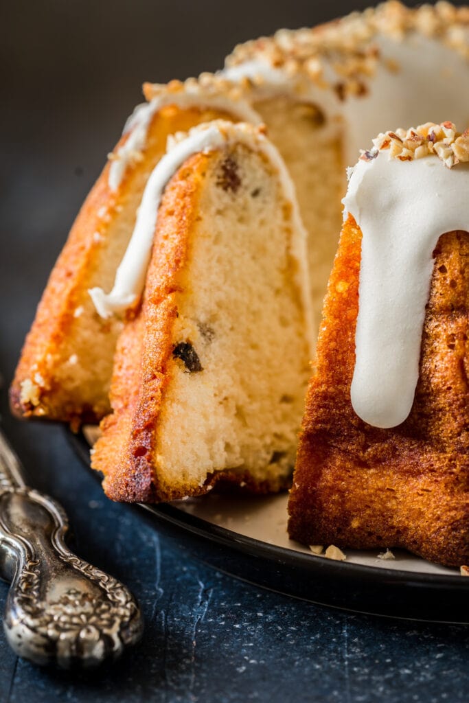 Sliced Bacardi rum cake with dripping sugar glaze on top. 