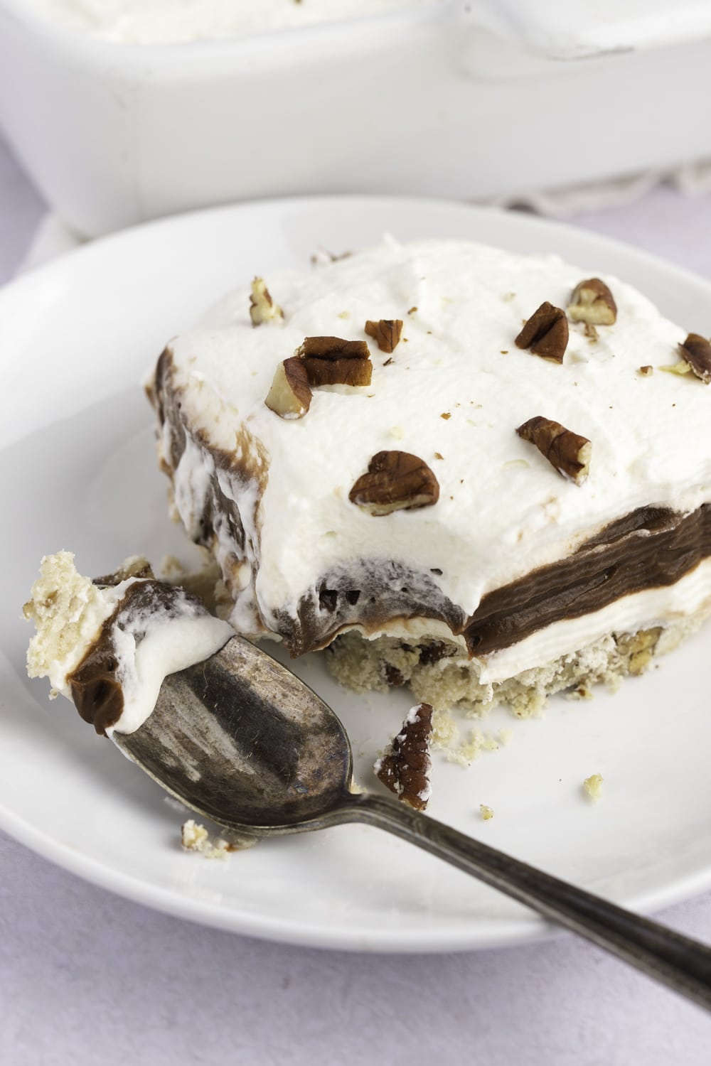 Easy Chocolate Delight Slice on a White Plate