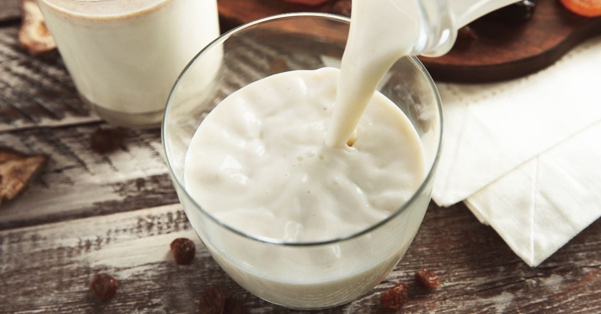 Half and Half Milk Pouring in a Glass