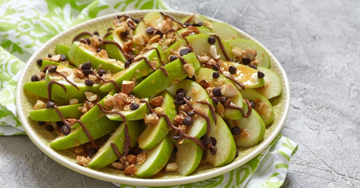 Homemade Apple Nachos with Caramel and Chocolate Chips in a Plate