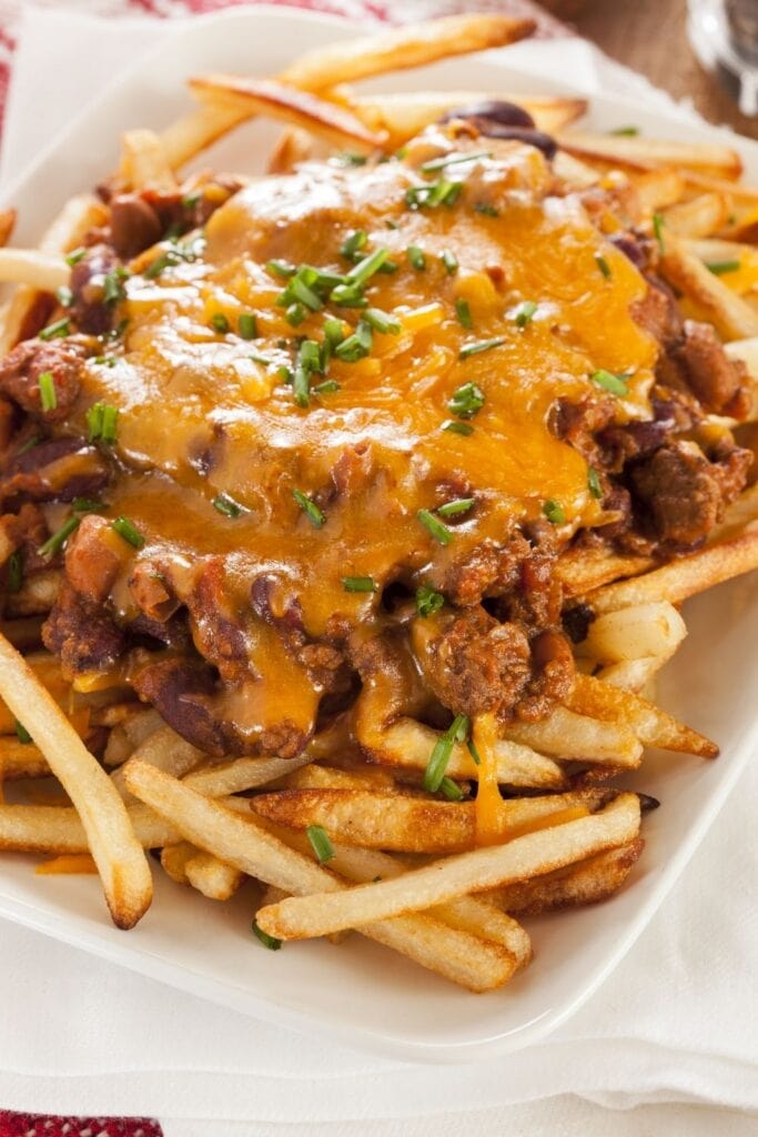 17 Loaded Fries Recipes You Won’t Want To Share Featuring Homemade Loaded Fries with Chili and Cheese