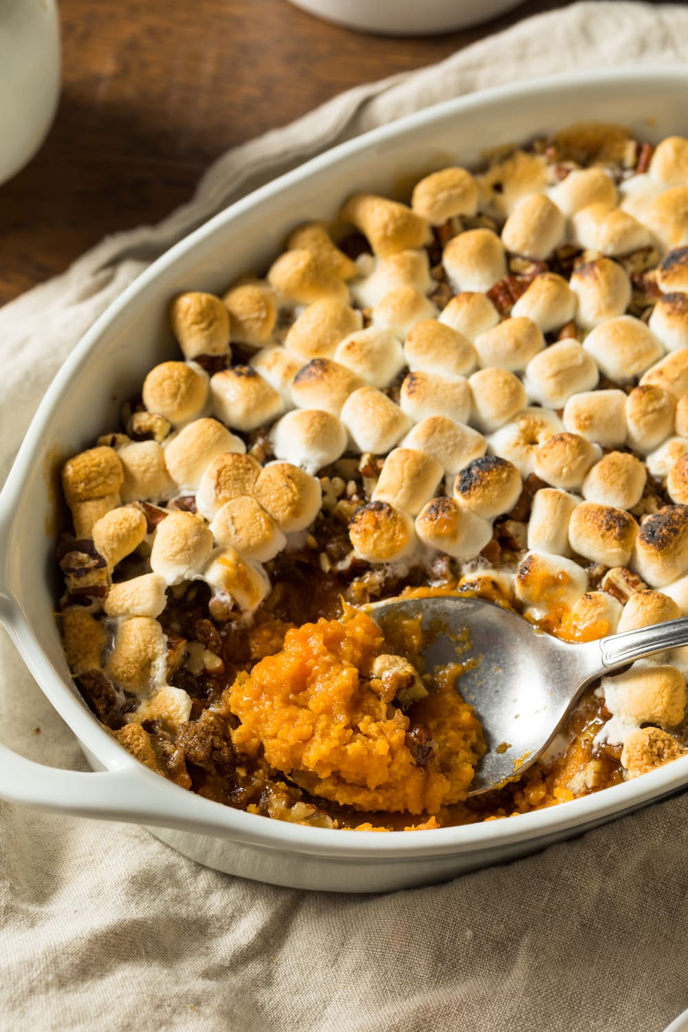 Classic Sweet Potato Casserole in a White Oval Dish