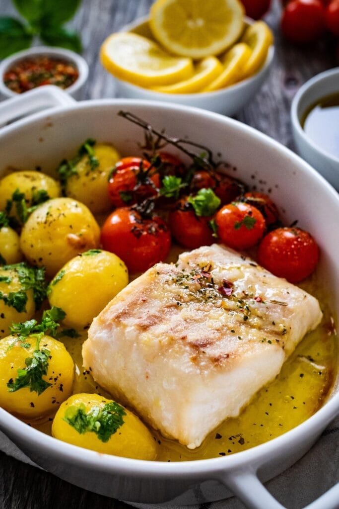 13 Easy Barramundi Recipes featuring  Roasted Barramundi with New Potatoes and Cherry Tomatoes in a Butter Sauce