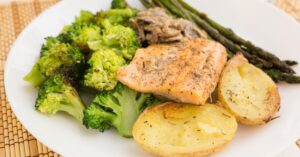 Homemade Trout Fillet Garnished with Broccoli, Asparagus and Potatoes