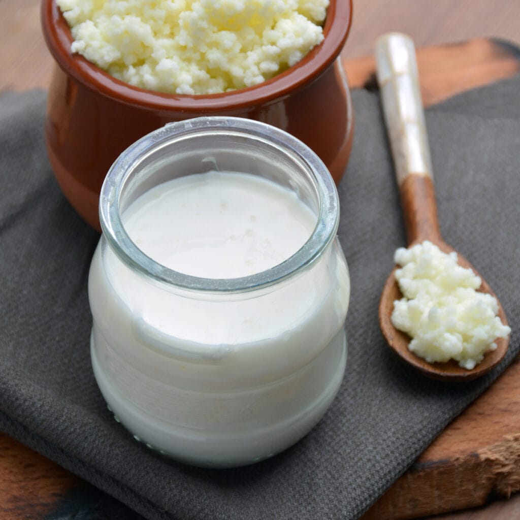 Kefir and Milk in a Wooden Table