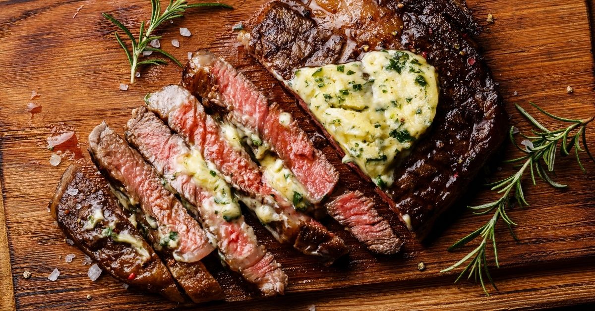 Sliced Butter Garlic Steak in a Wooden Board