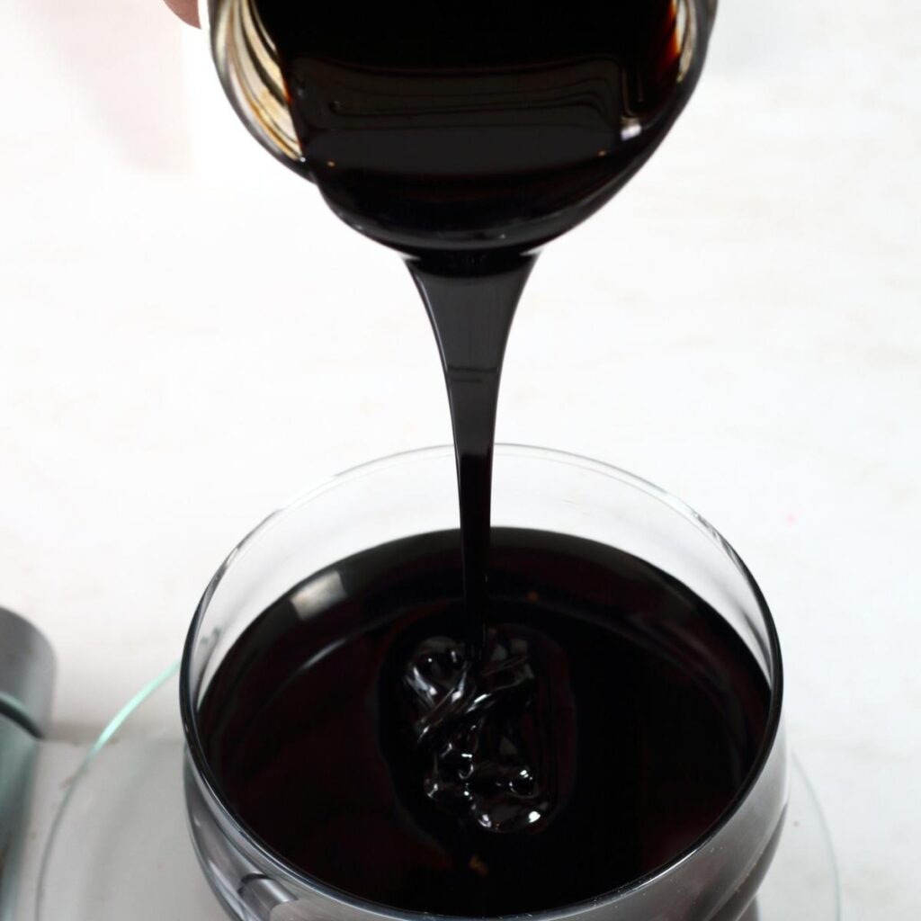 Blackstrap Molasses Poured on a Glass Dish