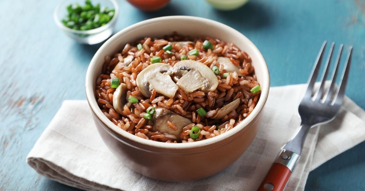 Bowl of Homemade Brown Rice with Mushrooms and Green Onions