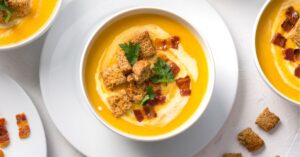 Bowl of Kabocha Squash Soup with Bacon and Crotouns