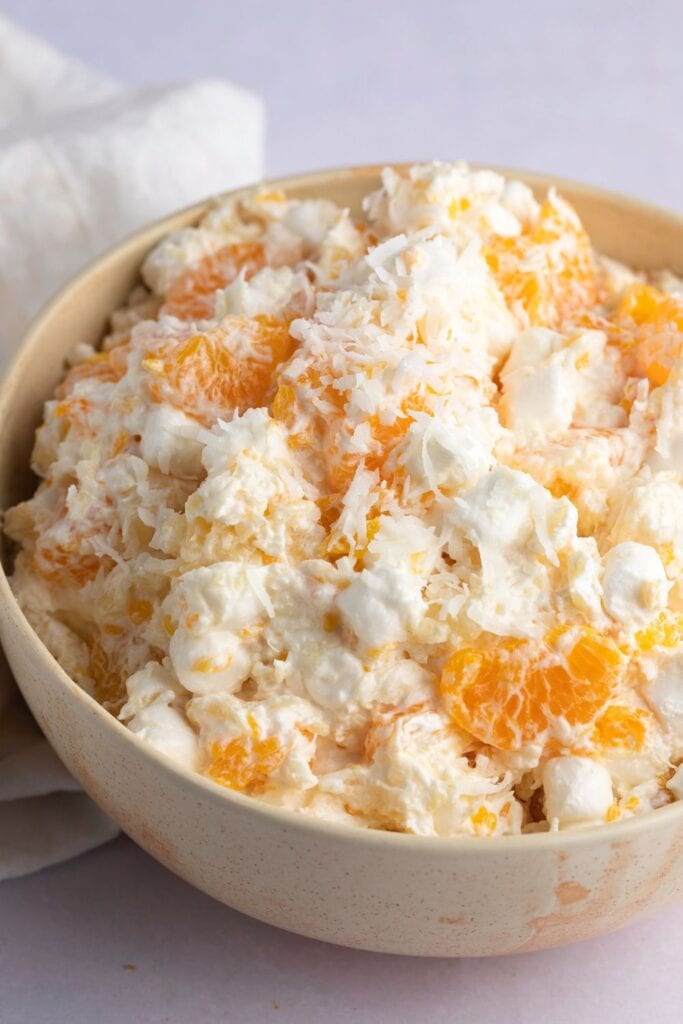 Creamy Ambrosia Salad with Mandarin, Oranges, Marshmallows and Shredded Coconut