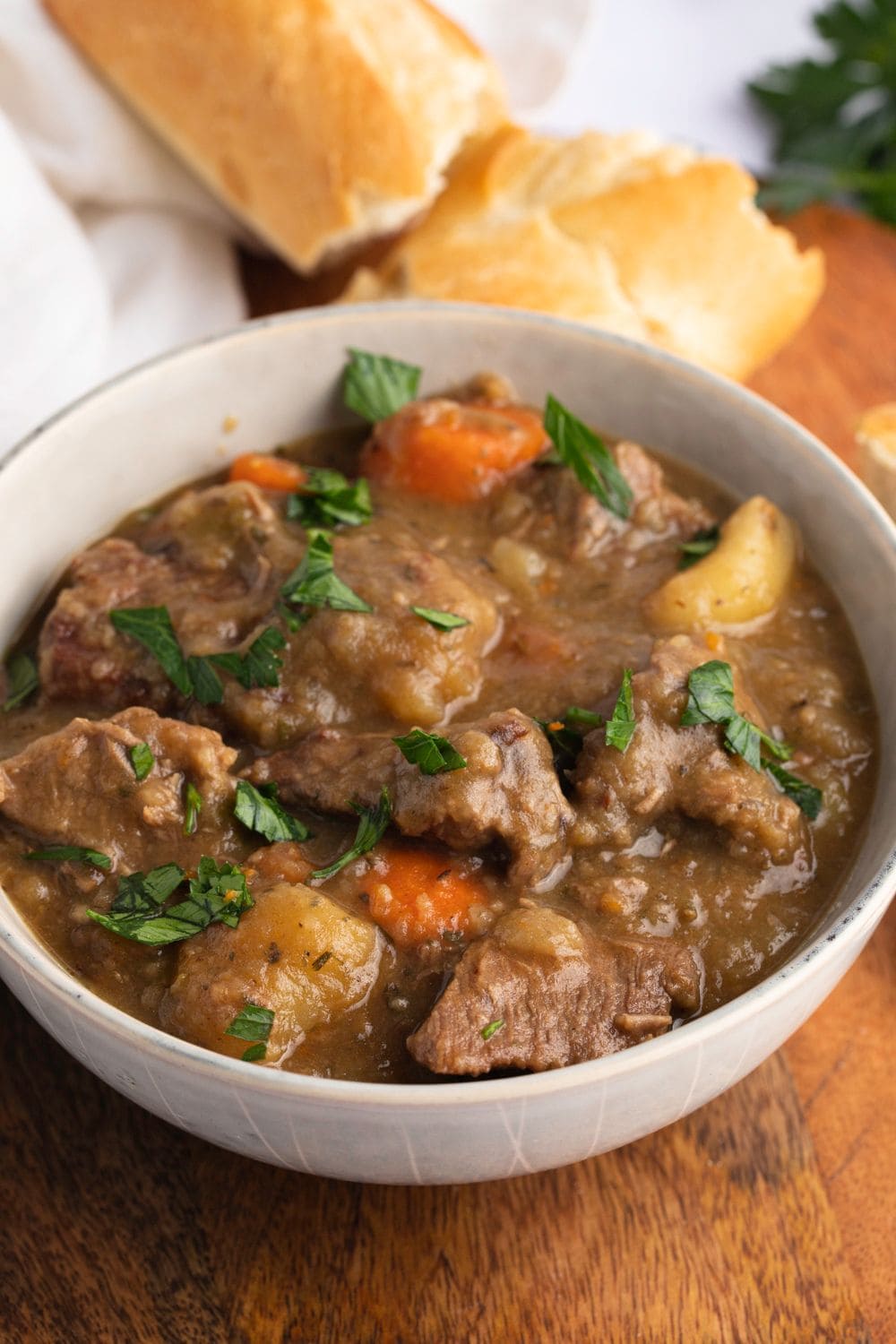 Bowl of warm and hearty Old-Fashioned Beef Stew with carrots and potatoes 