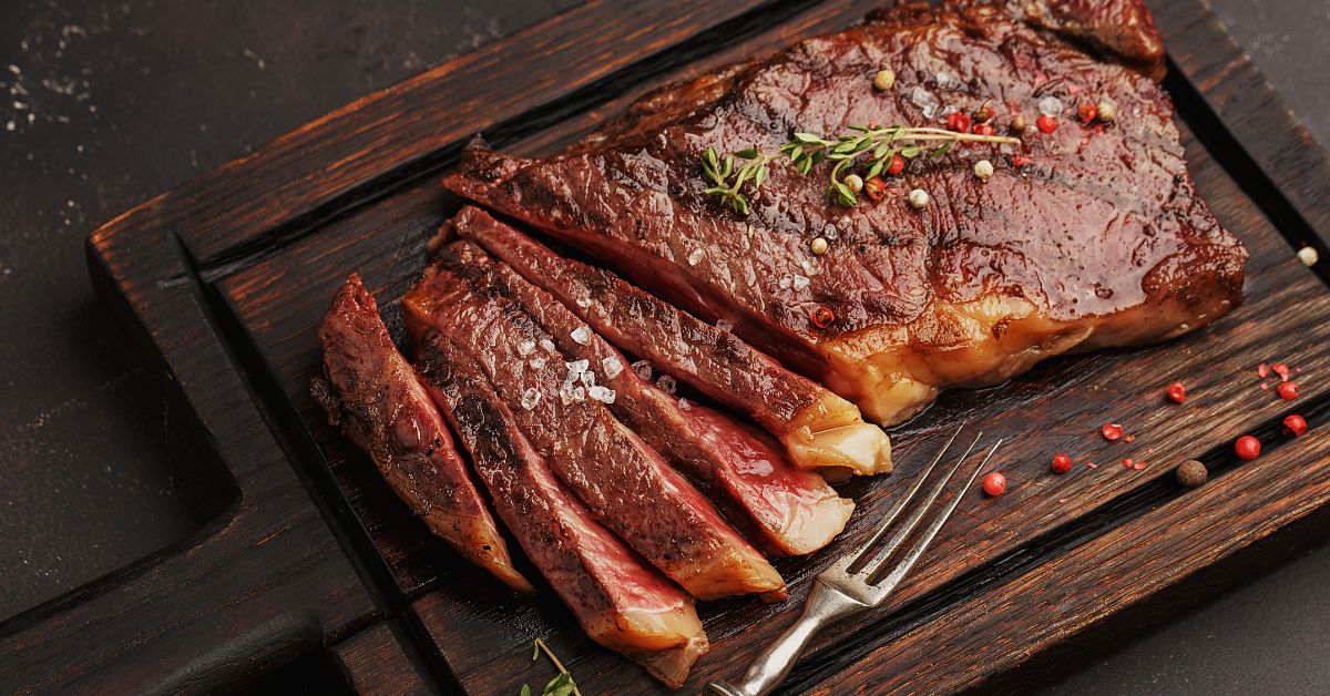 Sliced Steak in a Wooden Chopping Board