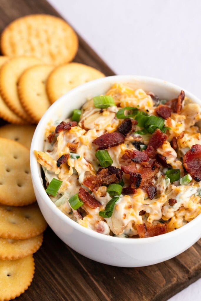 38 Easy Shredded Cheese Recipes: Cheesy Dip with Bacon and Crackers