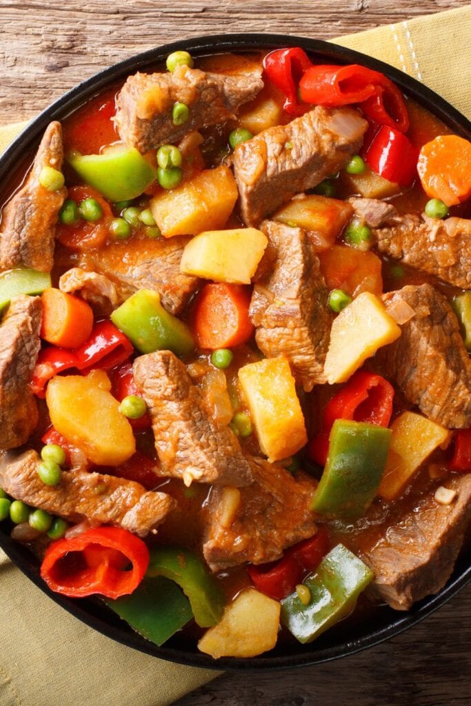 10 Hearty Filipino Beef Recipes for a Filling Feast. Shown in picture: Filipino Beef Caldereta with Peppers and Potatoes
